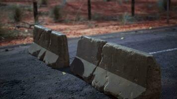 old rusted concrete road barrier blocks video