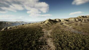 Afghanistan's mountain-encircled valley, with dry grass and plenty of stones video