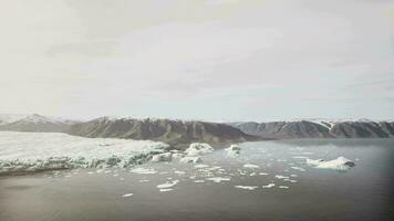 Icebergs float on glacier lagoon video