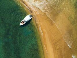 Aerial view of Speed boat in the aqua sea, Drone view photo