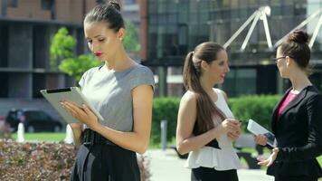 Business woman working on a tablet, and nods his head video