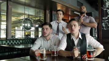 Four friends businessmen drink beer and rejoice video