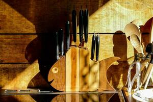 a knife block with knives and utensils on it photo