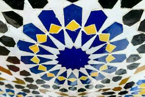 a close up of a colorful tile design photo