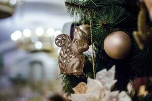 Christmas toys in the form of a squirrel hanging on the Christma photo