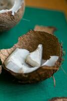 ugly organic broken rotten coconut. peel and white insides of a moldy coconut. Spoiled foods. photo