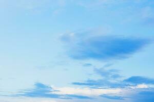 Blue clouds in sky during morning background. Clear skies with blue clouds at sunset above field. Open view out windows summer day. photo