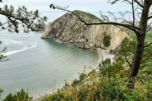 a view of the ocean from a cliff overlooking the water photo