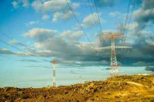 electricity pylons in the desert photo