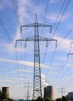 power lines and towers in front of a nuclear power plant photo