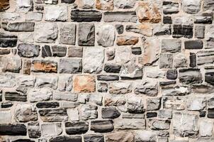 a wall made of stone with many different colors photo