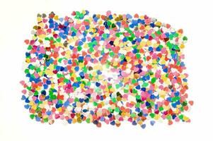 a large group of colored confetti is shown photo