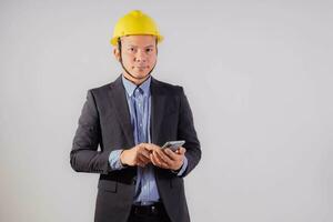 Asian male engineer on white background photo