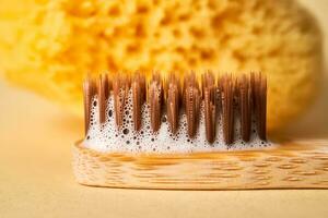 Toothbrush with toothpaste foam close-up. photo