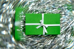 Green gift boxes on a gray background. photo