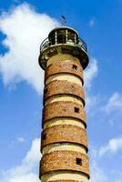 a brick tower with a blue sky in the background photo