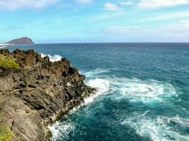 the rocky coastline of the island of galicia photo