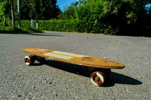 a skateboard with wheels on the ground photo
