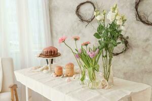 A set table for the celebration of Easter. Cakes and quail eggs on the Easter table. photo