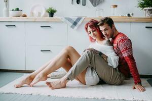 A couple in love - a man and a woman in a bright kitchen. The concept of a romantic relationship. photo