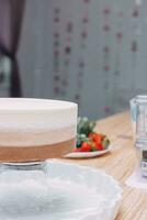 A piece of chocolate cake in the cut. Preparation of mousse cake at a culinary master class. Cooking at home, homemade food photo