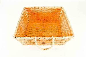 a wicker basket with handles on a white background photo