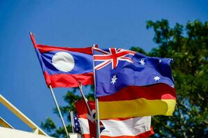 the flags of australia, laos, and germany photo