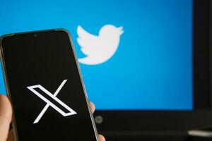 July 25, 2023, Russia. The logo in the form of the letter X displayed on the smartphone. Twitter rebranding, and implementation of X. photo