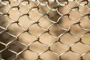 Mesh rabitz , texture of weaving mesh network link. Close up of a fence. barrier on way. metal grid close-up. rusty mesh texture photo