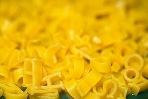 macaroni alphabet letters on a green plate. photo