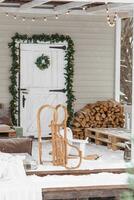 The porch of a country house decorated for Christmas and New Year holidays. photo