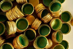 a pile of gold and green coins photo