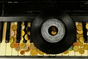 a record player with coins on it photo