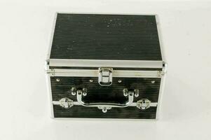 a black and silver suitcase with a handle photo