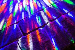 Lights of color music on the stone floor photo