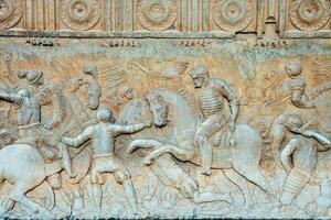 a relief depicting the battle between the romans and the persians photo