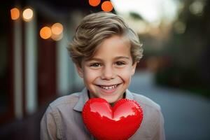 ai generado contento pequeño chico con rojo corazones en San Valentín día. foto