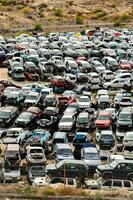 a large pile of cars in a parking lot photo