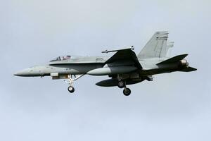 Finnish Air Force McDonnell Douglas F-18C Hornet HN-441 fighter jet arrival and landing at Leeuwarden Air Base for Frisian Flag 2015 Air Exercise photo