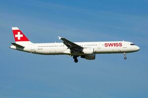 Swiss Inernational Airlines Airbus A321 HB-IOC passenger plane arrival and landing at Vienna Airport photo