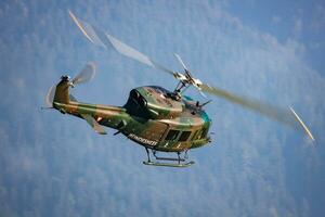 Austrian Air Force Bell-Agusta AB-212. Military transport helicopter at air base. Aviation and rotorcraft. Transport and airlift. Military industry. Fly and flying. photo