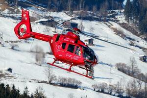 Medical helicopter at airport and airfield. Rotorcraft and medicopter. General aviation industry. Air ambulance transportation. Air transport. Fly and flying. photo