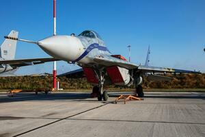 MiG-29 military fighter jet plane at air base. Air force flight operation. Aviation and aircraft. Air defense. Military industry. Fly and flying. photo