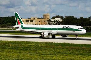 Alitalia passenger plane at airport. Schedule flight travel. Aviation and aircraft. Air transport. Global international transportation. Fly and flying. photo