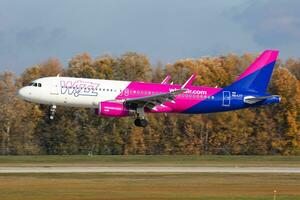 Wizz Air Airbus A320 HA-LYT passenger plane arrival and landing at Budapest Airport photo