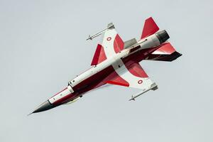 Royal Danish Air Force Lockheed F-16 Fighting Falcon fighter jet plane flying. Aviation and military aircraft. photo