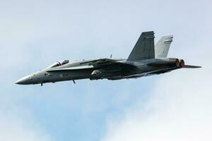 Finnish Air Force Boeing F-18 Hornet fighter jet plane flying. Aviation and military aircraft. photo