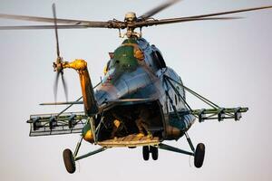 Hungarian Air Force Mil Mi-17 military transport helicopter. Flight operation and airlift. Aviation industry and rotorcraft. Fly and flying. photo