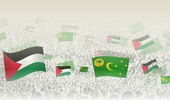 Palestine and Cocos Islands flags in a crowd of cheering people. vector