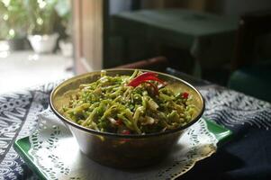 Traditional dish of stir-fried papaya flowers photo